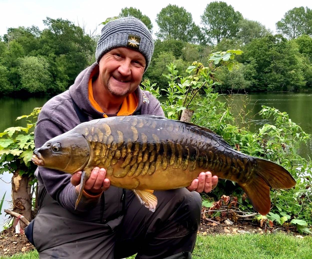 ian russell with a fuly scaled carp